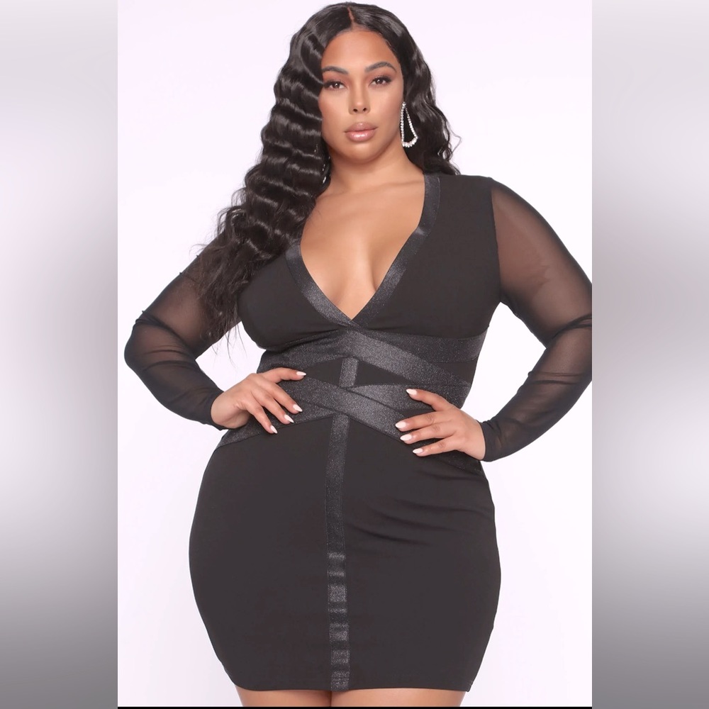 Black mini dress, mesh sleeves and cross cross waist detail with a lil shimmer.
